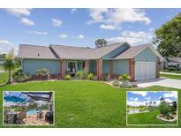 Charming single-story home with a well-manicured lawn and beautiful landscaping at 7175 Bottle Brush Dr, Spring Hill, FL 34606