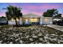 Charming single-story home with a well-maintained yard and inviting curb appeal in a quiet neighborhood at 7535 Christina Ln, Port Richey, FL 34668