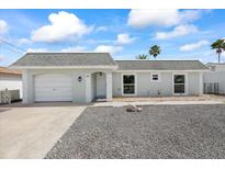 Charming single-Gathering home featuring an attached garage and a manicured front yard at 3907 Headsail Dr, New Port Richey, FL 34652