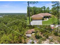 Aerial view of property boundaries and home nestled among tall trees in a peaceful, wooded neighborhood at 4960 Hidden Knob Trl, Spring Hill, FL 34609