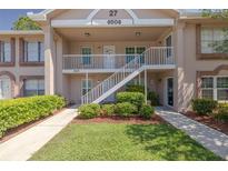 Charming two-story condo with well-maintained landscaping and inviting walkways at 6508 Tina Dr # 14, New Port Richey, FL 34653