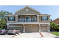 Inviting townhouse featuring a private balcony and attached garages, set in a well-maintained community at 8409 Blue Rock Dr, New Port Richey, FL 34653