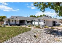 Charming single-story home with a well-manicured lawn and decorative stone landscaping at 10267 Elgin Blvd, Spring Hill, FL 34608