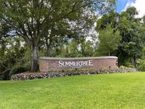 Welcome to Summertree, a lovely community sign surrounded by beautiful, mature trees and manicured landscaping at 11619 Boynton Ln, New Port Richey, FL 34654