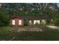 Charming single-story home with brick accents, cozy front porch and carport at 8102 Fort Dade Ave, Brooksville, FL 34601