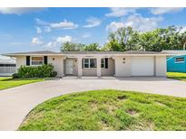 Charming single-story home with a well-manicured lawn and welcoming curb appeal at 4468 Rudder Way, New Port Richey, FL 34652