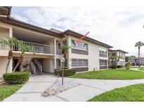 Charming condo with well-maintained landscaping and a welcoming entryway at 5123 Topaz Ln # 206, New Port Richey, FL 34652