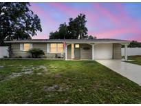 Charming single Gathering home with welcoming front yard and inviting exterior elevation at 7545 Banner St, New Port Richey, FL 34653