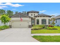 Charming single-Gathering home with a well-manicured lawn and a two-car garage at 11579 Weaver Hollow Rd, New Port Richey, FL 34654