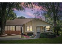 Charming single-story home featuring a well-manicured lawn and cozy front porch, perfect for relaxing evenings at 8158 Sturbridge Ct # D, Weeki Wachee, FL 34613