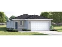 Charming single-story home with a two-car garage and beautifully landscaped front yard at 8921 Waxwing Way, Parrish, FL 34219