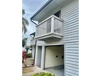 Exterior view of home featuring a garage and balcony at 6462 92Nd N Pl # 806, Pinellas Park, FL 33782