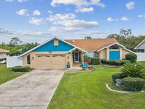 Charming single-Gathering home featuring well-maintained landscaping, a two-car garage, and a welcoming entrance at 14646 Coronado Dr, Spring Hill, FL 34609