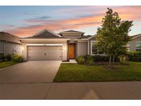 Charming single-Gathering home with a well-manicured lawn and a two-car garage at 1098 Old Windsor Way, Spring Hill, FL 34609