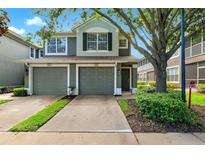 Charming townhome with a well-maintained lawn and a two-car garage, perfect for comfortable living at 2209 Kings Palace Dr # 21-204, Riverview, FL 33578