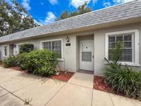 Charming condo exterior featuring a well maintained landscape and inviting entrance at 3712 Trophy Blvd # 3712, New Port Richey, FL 34655