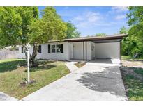 Charming single-story home with a covered carport and inviting front yard landscape at 7192 Catalina St, Spring Hill, FL 34606