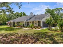 Charming single-story home with well-maintained landscaping and a welcoming front yard at 14645 Spellman Ct, Spring Hill, FL 34610