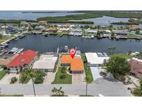 Waterfront home with private dock on canal with Gulf access and beautiful landscaping at 3701 Corsair Ct, New Port Richey, FL 34652