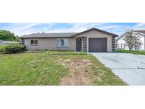 Charming single-story home with a one-car garage and drought-tolerant landscaping in a quiet neighborhood at 5543 Moog Rd, New Port Richey, FL 34652