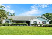 Charming single story home with a well manicured lawn, tasteful shrubbery and stone accents at 8522 Cranes Roost Dr, New Port Richey, FL 34654