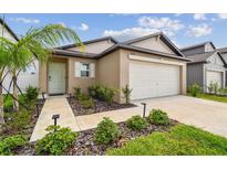 Charming single-story home with a well-maintained front yard and attached garage in a desirable neighborhood at 11395 Lavender Loop, Spring Hill, FL 34609