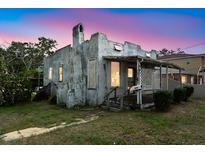 Charming single-Gathering home with a rustic facade, covered porch, and well-lit windows at 1601 Dixie Hwy, Tarpon Springs, FL 34689