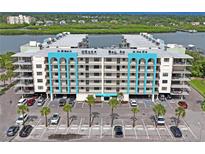 Stunning view of the waterfront condo with ample parking and beautiful landscaping at 19531 Gulf Blvd # 611, Indian Shores, FL 33785