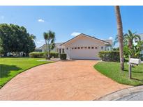Charming single-story home with a well-maintained lawn and a stamped concrete driveway at 5348 Lawrence Ln, New Port Richey, FL 34652