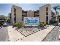 Rivermist Condominiums features assigned parking in a quiet community surrounded by lush landscaping and shade trees at 5640 Ferguson Ct # 2203, New Port Richey, FL 34652
