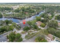 Gorgeous waterfront property with private dock and lush landscaping, a true Florida oasis at 6936 River Rd, New Port Richey, FL 34652