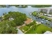 Stunning waterfront property with lush landscaping, private dock, and easy access to the open water at 8143 Channel Dr, Port Richey, FL 34668