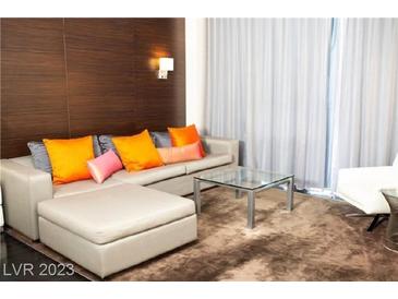 Spacious living room with sectional sofa and modern coffee table at 4381 W Flamingo Rd # 8320, Las Vegas, NV 89103