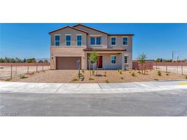 Two-story house with brown garage door and red front door at 7151 Serene Creek St, Las Vegas, NV 89131