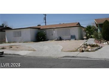 Single-story home with driveway and landscaping at 1932 Lawry Ave, North Las Vegas, NV 89032