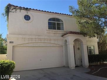 Two-story house with a two-car garage and front yard at 8829 Cornwall Glen Ave, Las Vegas, NV 89129