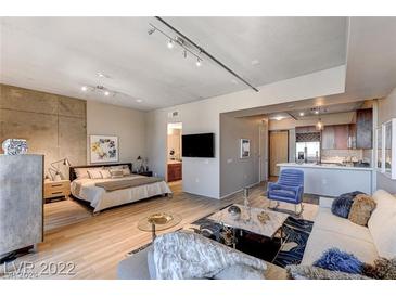 Open concept living room and kitchen with modern finishes at 353 E Bonneville Ave # 802, Las Vegas, NV 89101