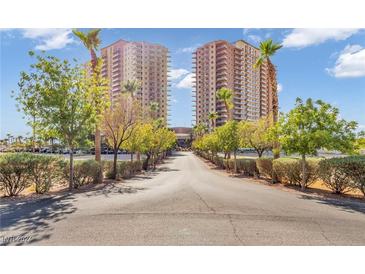 Twin high-rise residential buildings with a landscaped entryway at , Las Vegas, NV 89123