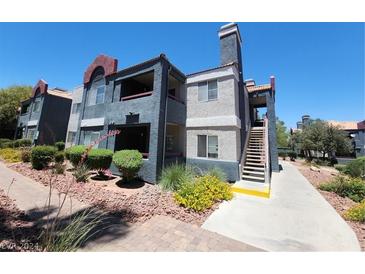 Two-story building with manicured landscaping at 8600 W Charleston Blvd # 2025, Las Vegas, NV 89117