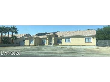 Single-story house with solar panels and a large front yard at 3640 Judson Ave, Las Vegas, NV 89115