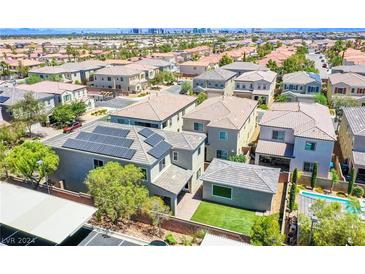 Aerial view of a house with solar panels and a pool at 8539 Helvetia Ln, Las Vegas, NV 89113