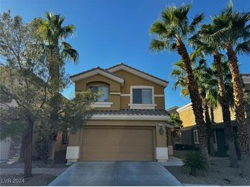 Two-story house with attached garage and palm trees at 4793 Frankfurt Ct, Las Vegas, NV 89147