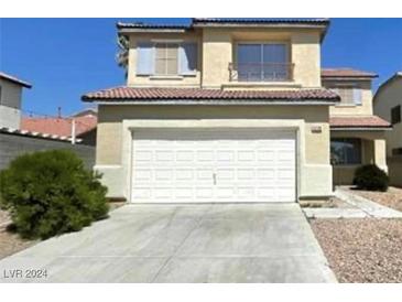 Two story house with white garage door at 5738 Bear Springs St, North Las Vegas, NV 89031