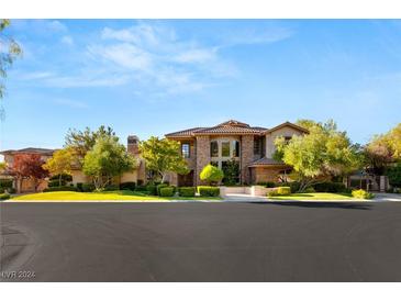 Elegant two-story home with stone accents and manicured landscaping at 14 Corral De Tierra Pl, Henderson, NV 89052