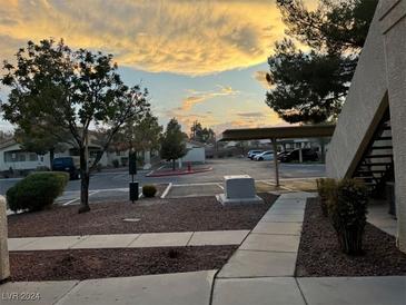 Well-lit parking lot with walkway access at 1881 W Alexander Rd # 2095, North Las Vegas, NV 89032