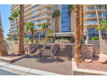 Regency Towers building entrance with palm trees at 3111 Bel Air Dr # 17A, Las Vegas, NV 89109