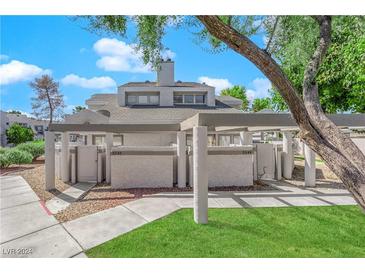 Two-story building with covered patio and walkway at 5543 Orchard Ln # 112, Las Vegas, NV 89110