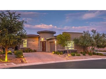 Luxury home with brick paver driveway and landscaping at 9928 Regency Square Ave, Las Vegas, NV 89148