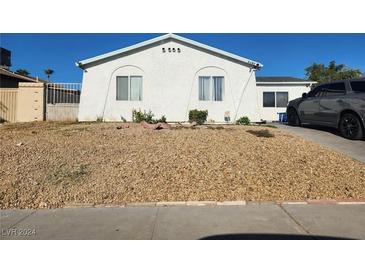 Exterior view of a single story home with a gravel front yard at 2512 Rialto Rd, Las Vegas, NV 89108