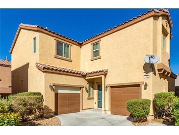 Two-story house with a two-car garage and landscaped yard at 7761 Vestibule Ct, Las Vegas, NV 89149